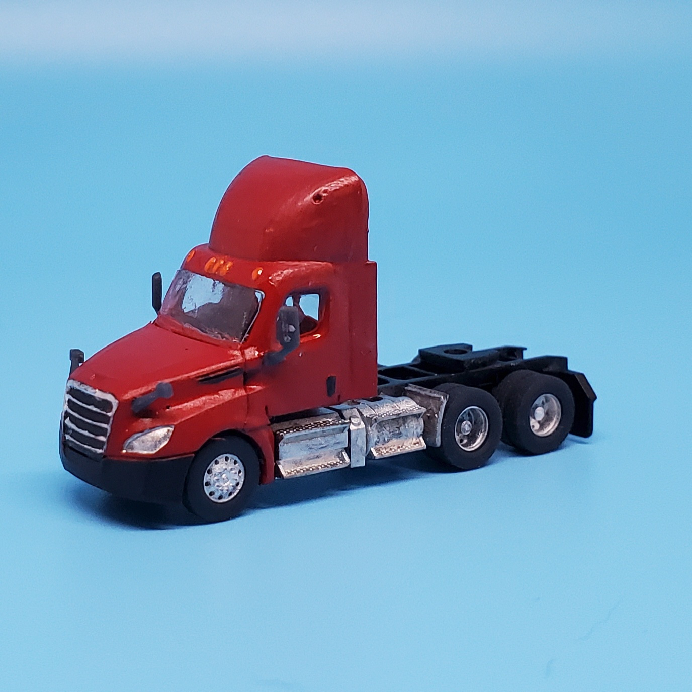 2018 to present Freightshaker Cascadia day cab with wind deflectors.